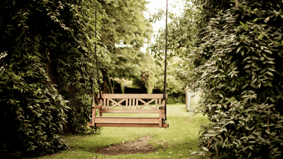 Wooden swing as a garden ornament